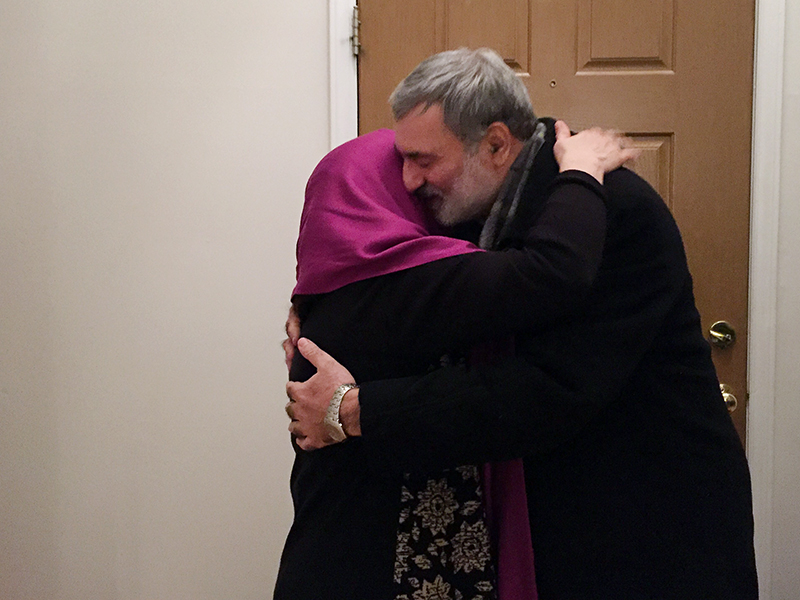 Mohsen Kadivar and his wife, Zahra “Nikoo” Roodi, embrace at the door of their Chapel Hill, N.C., home on Feb. 16, 2017. Kadivar had to cut short a Berlin fellowship because of President Trump's travel ban. RNS photo by Yonat Shimron