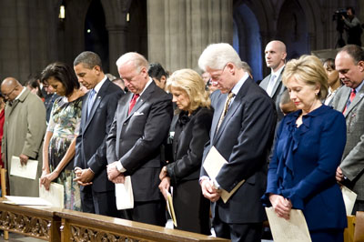 Left to right, Michelle and Barack Obama, Joe and Jill Biden, and Bill and Hillary Clinton pray during the National Prayer Service at Washington National Cathedral. 