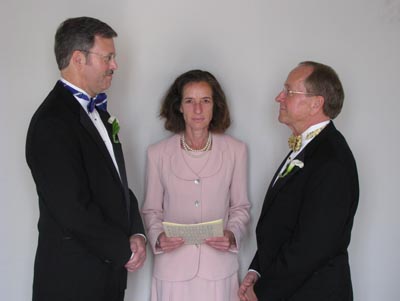Episcopal Bishop V. Gene Robinson, right, enters a New Hampshire civil union with his longtime partner, Mark Andrew, left, at St. Pauls Episcopal Church in Concord, N.H. At center is Justice of the Peace Ronna Wise.  