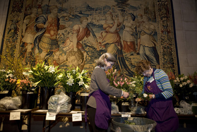 (RNS8-APR09) Altar guild volunteers Diane Cunningham, left, and Jean Bentz, right, group flowers in St. Mary's Chapel ahead of Easter services at Washington National Cathedral. Religion News Service photo by David Jolkovski. 