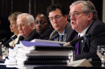 (RNS) Bob Bennett, right, a Washington attorney and member of the Catholic Church's National Review Board, discusses the board's report on the Catholic sex abuse crisis at a news conference in February 2004. RNS file photo by J. Carrier. 
