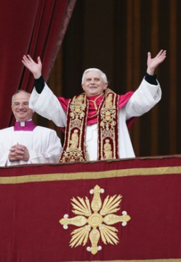 (RNS) Pope Benedict XVI greets a roaring crowd upon his introduction as the Roman Catholic Church's new pontiff on April 19, 2005. RNS file photo by Grzegorz Galazka. 