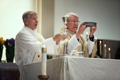 (RNS4-MAY18) Deacon Joe Krysiak, is shown here during Holy Communion at one of two parishes he runs, of St. Anthony of Padua Catholic Church in Baltimore. The Mass was celebrated by visiting priest the Rev. Roman Korzacheson. Deacons have a growing role in the Roman Catholic Church as there are less priests to go around. For use with RNS-CATHOLIC-DEACONS, transmitted May 18, 2010. Religion News Service photo by Dennis Drenner. 