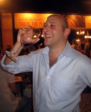 (RNS2-AUG18) Iain Levy enjoys a glass of wine at the Jerusalem Wine Festival, where vintners unveiled new lines of kosher wines for sophisticated palates. For use with RNS-KOSHER-WINE, transmitted Aug. 18, 2010. RNS photo by Eleanor Goldberg. 