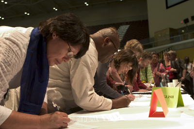 (RNS2-AUG12) Delegates from around the world sign in at the recent World Communion of Reformed Churches meeting in Grand Rapids, Mich., where 74 delegates were denied visas to attend. For use with RNS-RELIGION-VISAS, transmitted Aug. 12, 2010. RNS photo courtesy Erick Coll/UGC. 