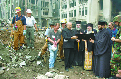 (RNS2-AUG23) Archbishop Demetrios of the Greek Orthodox Archdiocese of America, right (with gold vestments), leads a memorial service in 2001 at the site of the former St. Nicholas Greek Orthodox Church, which was destroyed by falling rubble from the World Trade Center during the 9/11 terrorist attacks. Attempts to rebuild the church have run into bureaucratic delays. For use with RNS-WTC-CHURCH, transmitted Aug. 23, 2010. RNS photo courtesy Dimitrios Panagos/Greek Orthodox Archdiocese of America. 