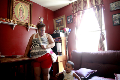 (RNS2-SEPT15) Paola Leiva has lived in her apartment in Union City, N.J., for the past 8 months with a roommate Wendy Lopez and Lopez's son Cristian. The building, which has extensive maintenance issues, bedbugs and  no child restraints over the windows, is owned by Feisal Abdul Rauf, the imam behind the controversial proposal to develop an Islamic cultural center near Ground Zero. For use with RNS-IMAM-LANDLORD, transmitted Sept. 15, 2010. RNS photo by  Aristide Economopoulos/The Star-Ledger. 