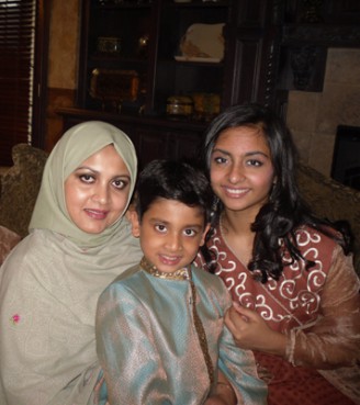 (RNS2-SEPT8) Mohammad S. Chowdhury, a waiter at Windows on the World restaurant on the top floor of the World Trade Center's North Tower, was a 9/11 victim. His family (wife Baraheen Ashrafi, left, son Farqad, 8, and daughter Fahina, 14) say his death is made more painful by Americans who conflate Islam and terrorism. For use with RNS-MUSLIMS-911, transmitted Sept. 8, 2010. Religion News Service photo courtesy of Baraheen Ashrafi. 