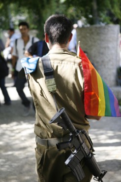 (RNS1-OCT22) Gays and lesbians, like this soldier seen here at a 2009 gay pride parade in Jerusalem, have served openly in the Israeli Defense Forces since 1983. Israel has reportedly offered guidance to the Pentagon in dismantling Don't Ask/Don't Tell, but parallels between the two countries are inexact. For use with RNS-GAYS-MILITARY, transmitted Oct. 22, 2010. RNS photo by Tomer Appelbaum. 