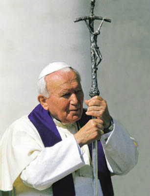 (RNS) Pope John Paul II participates in a procession in August, 2000. RNS file photo courtesy Universal Press Syndicate. 