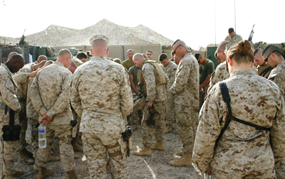 (RNS1-JUN14) In Iraq, chaplain Endel Lee (center, wearing protective jacket) leads a prayer before a convoy leaves base in 2005. Southern Baptists like Lee have a large presence among active-duty military chaplains, and some denominational leaders say they will have to resign when the repeal of Don't Ask/Don't Tell takes effect. For use with RNS-DADT-CHAPLAINS, transmitted March 25, 2011. Religion News Service courtesy of Baptist Press. 