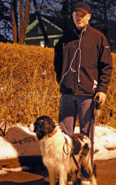 (RNS1-MAR18) David Lincoln of Grand Rapids, Mich., downloads Dominican prayers on his iPod to use during his morning walks with his dog, Kerby. Lincoln is a lay Dominican associate with the Grand Rapids Dominican Sisters. For use with RNS-LAY-DOMINICANS, transmitted March 18, 2011. RNS photo by Dave Odette/The Grand Rapids Press. 
