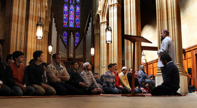 (RNS2-MAR28) Imam Omer Bajwa (standing) speaks to Muslim students at Yalke University after prayers in Dwight Hall Chapel. For use ONLY with RNS-MUSLIM-CHAPLAINS, transmitted March 28, 2011. USA Today photo by Stan Godlewski. 