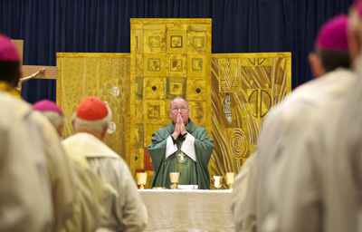 Archbishop Timothy Dolan of New York, president of the U.S. Conference of Catholic Bishops, celebrates Mass for other bishops at their summer meeting in Bellevue, Wash.  