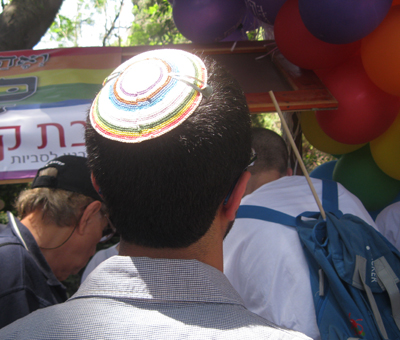(RNS1-JUN13) An Orthodox gay man wears a gay pride yarmulke at Tel Aviv's gay pride festival in a symbolic gesture of greater visibility for gay religious Jews. For use with RNS-ORTHO-GAYS, transmitted June 13, 2011. RNS photo by Michele Chabin. 