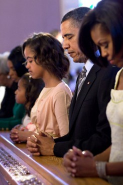 (RNS) President Obama and his family pray during Easter services at Allen Chapel AME Church in Washington on April 4, 2010. As many as four in 10 Americans cannot identify the president as a Christian. RNS file photo courtesy Pete Souza/The White House. 