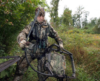 (RNS1-JUL18) Chad Reed of Lititz, Pa., sets up a tree stand as he looks for a spot to archery hunt on state game lands in South Londonderry Twp., Pa. Pennsylvania lawmakers will debate this fall whether to lift a ban on Sunday hunting. For use with RNS-SUNDAY-HUNTING, transmitted Sept. 18, 2011. RNS photo by Christ Knight / The Patriot-News. 