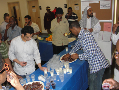 (RNS-AUG02) Worshipers at the Islamic Society of Boston Cultural Center break their fasts with dates and water or milk, at the Islamic Society of Boston Cultural Center on August 1, the first day of Ramadan.  For use with RNS-RAMADAN-DATES, transmitted August 2, 2011 