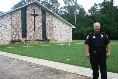 (RNS1-SEPT26) Mike Rowland, the police chief in Bay Minette, Ala., started Operation Restore Our Community that gives non-violent offenders the option to attend church or do jail time and pay fines. For use with RNS-CHURCH-JAIL, transmitted Sept. 26, 2011. RNS photo by Connie Baggett/Press-Register. 