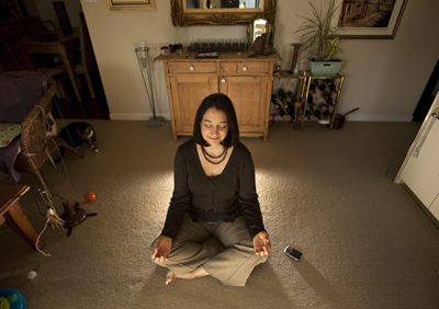 (RNS2-SEPT20) Entrepreneur Wendy Woods poses while meditating next to her Blackberry in her Toronto apartment. For use wiht RNS-ENTRE-MEDITATE, transmitted Sept. 20, 2011. USA Today photo by Darren Calabrese. 