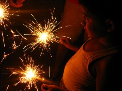 (RNS1-OCT25) A Hindu boy holds sparklers to celebrate the Hindu new year holiday of Diwali. For use with RNS-DIWALI-MAINSTREAM, transmitted Oct. 25, 2011. RNS photo courtesy Wikimedia. 