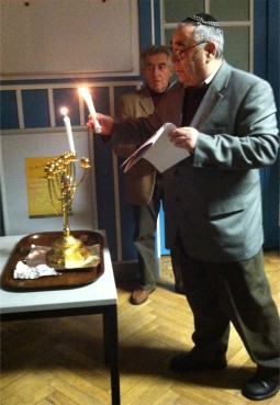 (RNS1-DEC22) Residents of Luebeck, Germany, light a menorah on the first night of Hanukkah. Most Jews in the northern port city are immigrants from the former Soviet Union, and despite a Jewish renaissance across Germany, Luebeck has not a full-time rabbi since 1995. For use with RNS-HANUKKAH-GERMANY, transmitted Dec. 22, 2011. RNS photo by Omar Sacirbey 