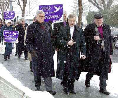 (RNS1-DEC17) The Rev. Bob Edgar (center) of the National Council of Churches participates in a 
Feb. 26, 2003, anti-war rally with the Rev. Jean Arnold de Clermont (left), head of the French 
Protestant churches, and Bishop Manfred Kock (right) of the German Protestant Church. Many 
religious leaders, including Pope John Paul II, spoke out strongly against the looming U.S.-led 
invasion of Iraq that began in March. See RNS-YEAREND-REVIEW, transmitted Dec. 17, 2003. 
RNS file photo by Mark Abraham. 