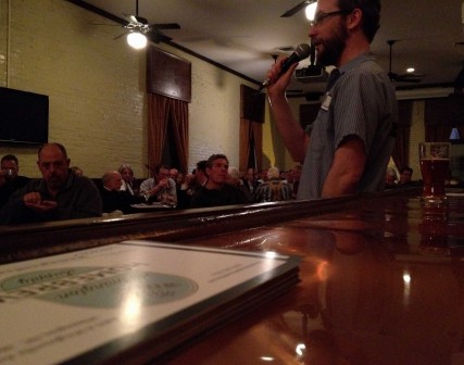 Assistant brewer Christopher McGarvey lectures on the history of beer in ancient Samaria to a crowd of about 90 people at Front Street Brewery in Wilmington, N.C. 