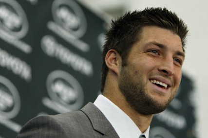 Quarterback Tim Tebow addresses the media during his debut with the New Jersey Jets in Florham Park, N.J., on March 26, 2012. 
