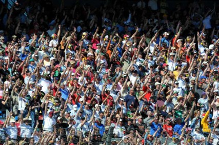 NASCAR fans hoist three fingers into the air during the third lap of the 53rd running of the Daytona 500 on Sunday to honor the late Dale Earnhardt, who was killed in a crash here 10 years ago while driving the No. 3 Goodwrench Chevrolet. 