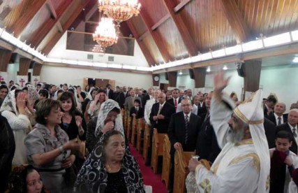 Rev. Joseph Boules performs a service at St. Mary & St. Verena Coptic Orthodox Church in Anaheim, Calif. Boules says it’s important to remember the situation is precarious for many in Egyptian society, not just Coptic Christians. 