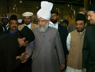 The worldwide spiritual leader of the Ahmadiyya Muslim movement, Mirza 
Masroor Ahmad, greets followers of the Ahmadiyya movement during their convention in 
Harrisburg, Pa. The movement attracts persecution overseas and skepticism from some U.S. 
Muslims because of some unorthodox beliefs.  