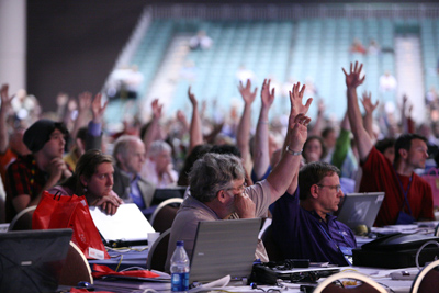 Delegates at the 2010 Presbyterian Church (USA) General Assembly in Minneapolis vote by a show of hands. Delegates voted to lift a ban on gay and lesbian clergy, which was affirmed on May 10 by a majority of the church's 183 regional presbyteries.  