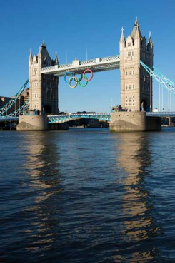 London, United Kingdom - June, 28th 2012: Olympic rings adorn Tower Bridge on a sunny evening. Originally lowered into place on June 27th 2012 to mark one month before the start of the London 2012 Olympic Games. 