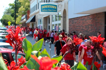 People wearing red shirts gathered in downtown Columbia, Mo., on Friday to show support to the family of Sterling Wyatt, a local soldier who died July 11 in Afghanistan. Wyatt's funeral was held at a downtown church, and people in red surrounded the church and spread several blocks down the street. 