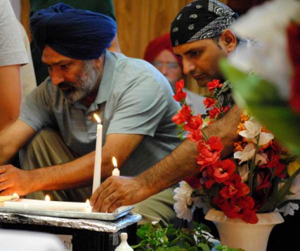 Members of the Spokane, Wa. community light candles to honor those slain at a Wisconsin Sikh temple on Wednesday Aug. 8, 2012. 