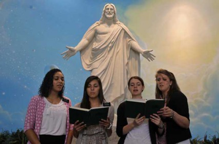 One of the mission assignments of the LDS church is to work in the Independence Visitor's Center in Independence, Mo. From left: Sister Lettig, Sister Minall, Sister Bingham and Sister Richardson sing to visitors after they take a tour of the center on Sunday, August 19, 2012. 