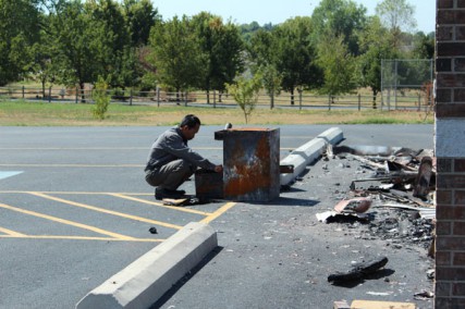 Imam Lahmuddin looks through a filing cabinet outside what used to be the mosque in Joplin, Mo. The mosque was burned down Aug. 6, 2012 and the fire is still under investigation. 