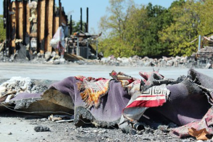Tattered prayer rugs are among the remains of what was once a mosque in Joplin, Mo. 