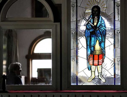 Hundreds of people visit the Shrine of Our Lady of Martyrs in Auriesville, NY on Saturday July 21, 2012. The shrine is site of the 17th century Mohawk village of Ossernenon. Three French Jesuit missionaries were martyred there in bringing the Catholic faith to the new world. A stained glass window of Kateri Tekakwitha is in the Martyrs and Kateri Chapels. Kateri, a Mohawk was born here, and will be one of seven Saints inducted during a Canonization ceremony at the Vatican on October 21, 2012. 