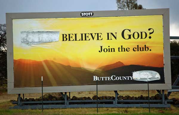 A billboard posted in Chico, Calif., that originally read “Don’t believe in God? Join the club” was defaced on Dec. 12, less than a week after it appeared, with vandals removing the word “don’t.”  RNS photo courtesy United Coalition of Reason