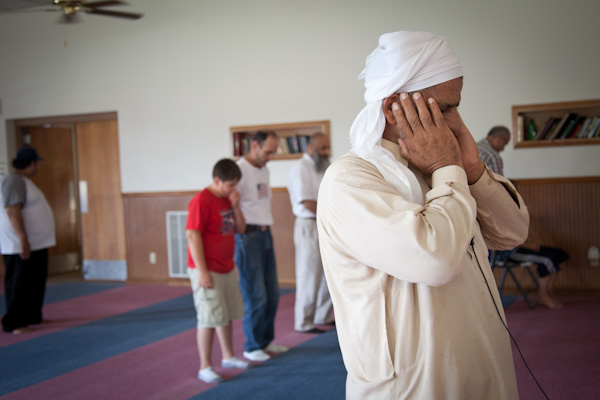 Muhhamad Shafiq says a prayer into the microphone during 1:30 prayer at the Islamic Society of Greater Kansas City mosque on Tuesday afternoon, June 26, 2012.  RNS photo by Sally Morrow