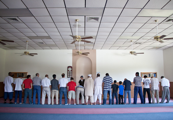 Men pray toward the direction of Kabah in Mecca during 1:30 prayer at the Islamic Society of Greater Kansas City on Tuesday afternoon, June 26, 2012.  RNS photo by Sally Morrow