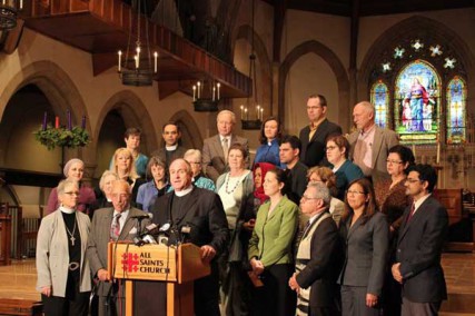 The Rev. Ed Bacon, rector of All Saints Episcopal Church in Pasadena, Calif., stands with local interfaith leaders to defend the church's decision to host the upcoming Muslim Public Affairs Council convention at the flagship progressive church. 