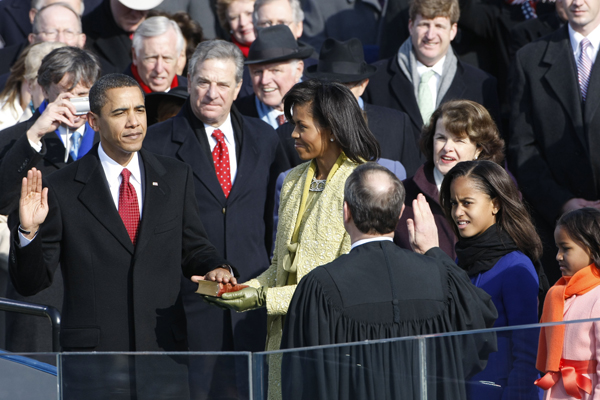 Chief Justice John G. Roberts, Jr. administers the oath of office to President Barack H. Obama, with his hand on the Lincoln bible, during the presidential inauguration ceremony in Washington, DC on Jan. 20, 2009.  RNS photo by Noah K. Murray/The Star-Ledger