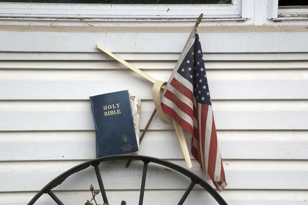 Flag and Bible in front of a home impacted by Hurricane Sandy on Staten Island, NY. Recovery work is being done by Volunteers in Mission through the New York Annual Conference, United Methodist Church. RNS photo by Arthur McClanahan/Iowa Annual United Methodist Conference.