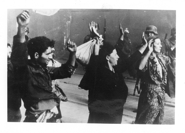 A group of Jews are taken prisoner during the Warsaw Ghetto uprising of April 1943. For use with RNS-GUNS-HOLOCAUST, transmitted on February 6, 2013. Religion News Service file photo