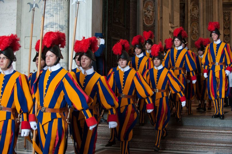 Swiss guards proceed out of St. Peter's basilica on March 12, 2013 at the Vatican. RNS photo by Andrea Sabbadini