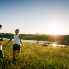Happy family at sunset photo courtesy Shutterstock. (http://shutr.bz/YplR3R)