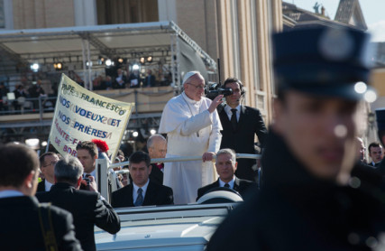Pope Francis waves from the pope-mobile during his inauguration Mass at St. Peter's Square on Tuesday (March 19) at the Vatican. RNS photo by Andrea Sabbadini
